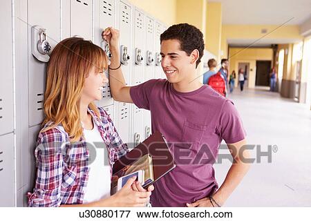 High School Students Standing By Lockers Talking View Large Photo Image Stock Photo - High School Students Standing By Lockers Talking. Fotosearch