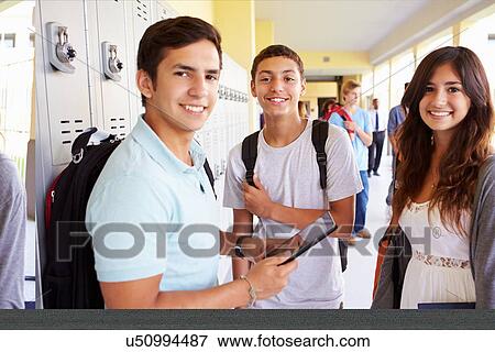 High School Students Standing By Lockers With Mobile Phone View Large Photo Image Stock Photo - High School Students Standing By Lockers With Mobile Phone. Fotosearch