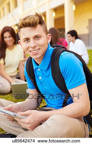 Picture - High School Students Studying Outdoors On Campus. Fotosearch