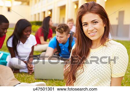 Stock Image - High School Students Studying Outdoors On Campus. Fotosearch