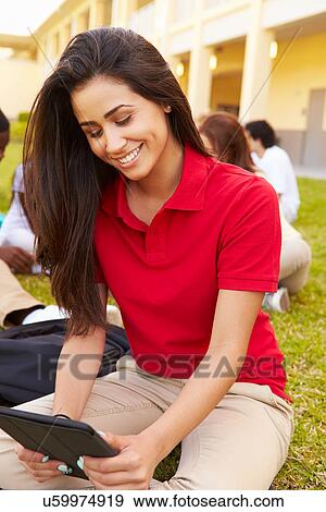 Stock Photo - High School Students Studying Outdoors On Campus. Fotosearch
