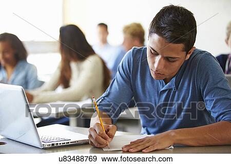 Stock Photo - High School Students Taking Test In Classroom. Fotosearch