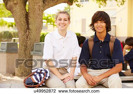 Stock Image - High School Students Wearing Uniforms On School Campus. Fotosearch