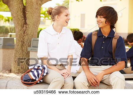 Stock Photograph - High School Students Wearing Uniforms On School Campus. Fotosearch