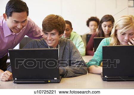High School Students With Teacher In Class Using Laptops View Large Photo Image Stock Image - High School Students With Teacher In Class Using Laptops. Fotosearch