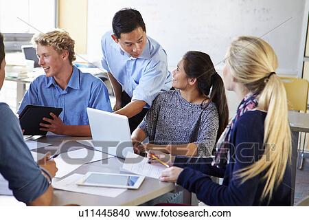 High School Students With Teacher In Class Using Laptops View Large Photo Image Stock Image - High School Students With Teacher In Class Using Laptops. Fotosearch
