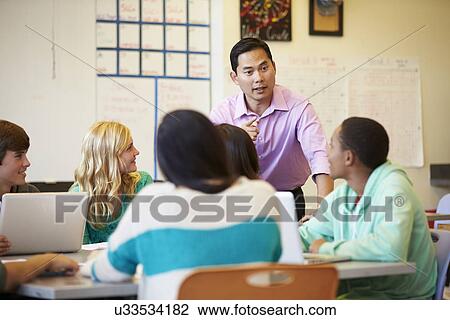 High School Students With Teacher In Class Using Laptops View Large Photo Image Stock Image - High School Students With Teacher In Class Using Laptops. Fotosearch