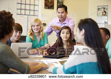High School Students With Teacher In Class Using Laptops View Large Photo Image Stock Image - High School Students With Teacher In Class Using Laptops. Fotosearch
