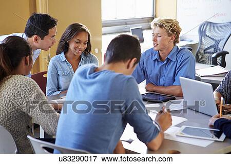 Stock Photo - High School Students With Teacher In Class Using Laptops. Fotosearch