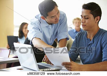 High School Students With Teacher In Class Using Laptops View Large Photo Image Stock Photo - High School Students With Teacher In Class Using Laptops. Fotosearch
