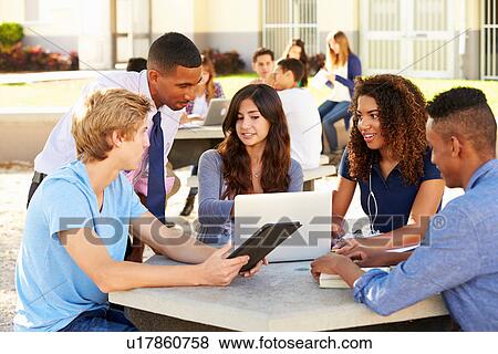 High School Students Working On Campus With Teacher View Large Photo Image Stock Photo - High School Students Working On Campus With Teacher. Fotosearch
