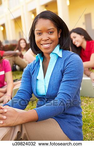 High School Teacher Sitting Outdoors With Students On Campus View Large Photo Image Stock Image - High School Teacher Sitting Outdoors With Students On Campus. Fotosearch