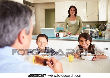 Hispanic Family Eating Breakfast At Home Together View Large Photo Image Stock Photo - Hispanic Family Eating Breakfast At Home Together. Fotosearch