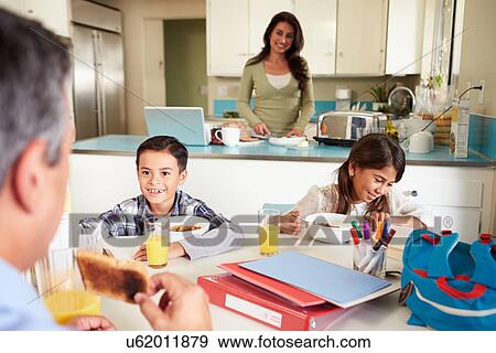 Hispanic Family Eating Breakfast At Home Before School View Large Photo Image Stock Photo - Hispanic Family Eating Breakfast At Home Before School. Fotosearch
