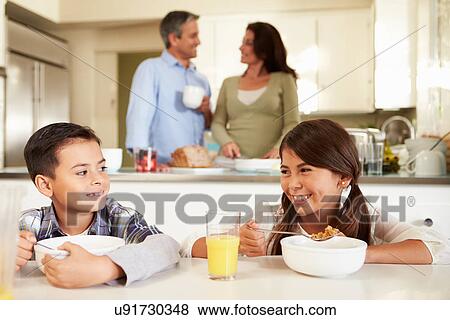 Hispanic Family Eating Breakfast At Home Together View Large Photo Image Stock Photo - Hispanic Family Eating Breakfast At Home Together. Fotosearch