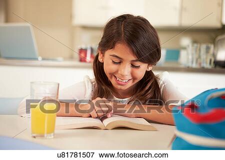 Hispanic Girl With Reading Homework At Table View Large Photo Image Stock Photo - Hispanic Girl With Reading Homework At Table. Fotosearch