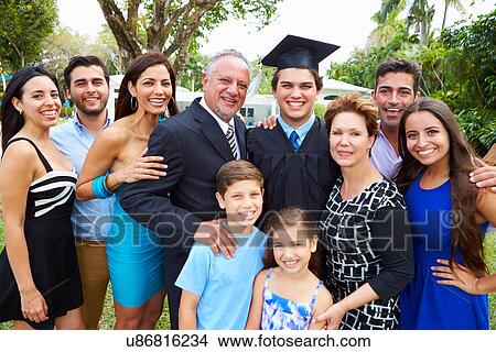 Picture - Hispanic Student And Family Celebrating Graduation. Fotosearch