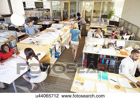 Stock Image - Interior Of Busy Modern Open Plan Office. Fotosearch