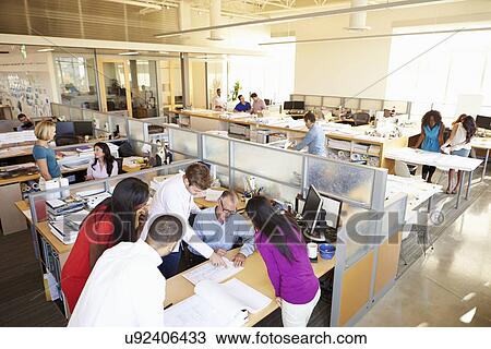 Stock Image - Interior Of Busy Modern Open Plan Office. Fotosearch
