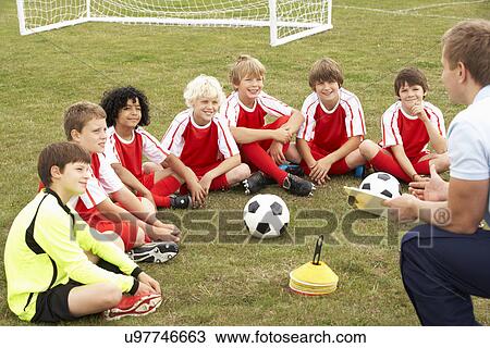 Junior football team training with coach View Large Photo Image Stock Image - Junior football team training with coach. Fotosearch