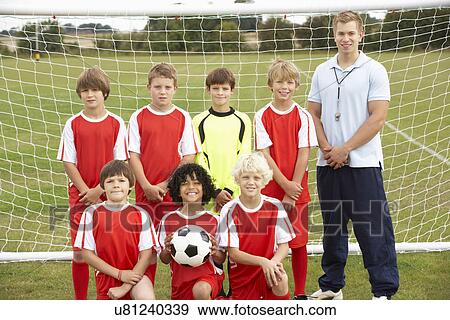 Stock Photo - Junior soccer team and coach portrait. Fotosearch