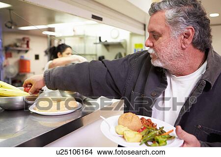 Picture - Kitchen Serving Food In Homeless Shelter. Fotosearch