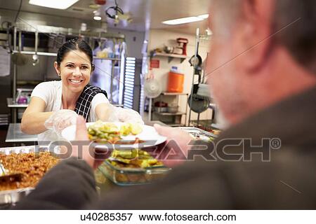 Stock Photo - Kitchen Serving Food In Homeless Shelter. Fotosearch