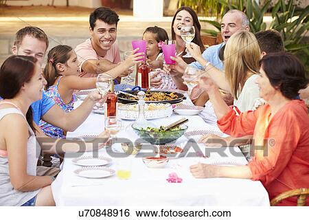Large Family Group Enjoying Meal On Terrace Together View Large Photo Image Stock Photograph - Large Family Group Enjoying Meal On Terrace Together. Fotosearch