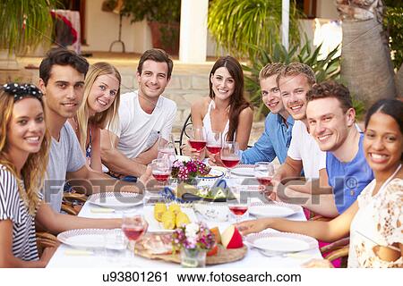 Large Group Of Young Friends Enjoying Outdoor Meal Together View Large Photo Image Stock Image - Large Group Of Young Friends Enjoying Outdoor Meal Together. Fotosearch
