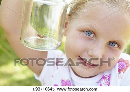 Little girl with cricket in a jar View Large Photo Image Stock Photography - Little girl with cricket in a jar. Fotosearch