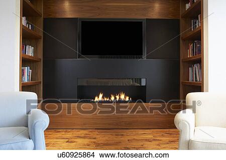 Lounge In Modern Home With TV And Fireplace View Large Photo Image Picture - Lounge In Modern Home With TV And Fireplace. Fotosearch