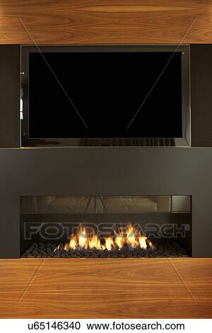Lounge In Modern Home With TV And Fireplace View Large Photo Image Stock Image - Lounge In Modern Home With TV And Fireplace. Fotosearch