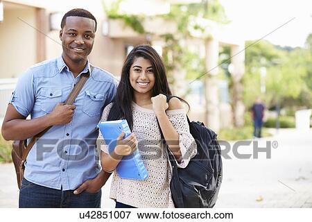 Male And Female University Students Outdoors On Campus View Large Photo Image Stock Photo - Male And Female University Students Outdoors On Campus. Fotosearch