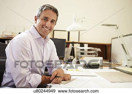 Male Architect Working At Desk In Office View Large Photo Image Stock Photo - Male Architect Working At Desk In Office. Fotosearch