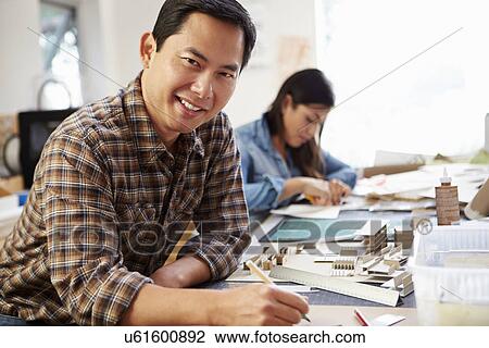Male Architect Working On Model In Office View Large Photo Image Stock Image - Male Architect Working On Model In Office. Fotosearch