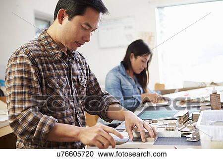 Male Architect Working On Model In Office View Large Photo Image Stock Image - Male Architect Working On Model In Office. Fotosearch