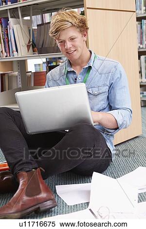 Male College Student Studying In Library With Laptop View Large Photo Image Stock Photography - Male College Student Studying In Library With Laptop. Fotosearch