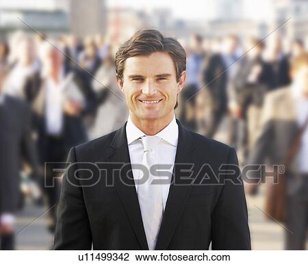 Male commuter in crowd View Large Photo Image Stock Image - Male commuter in crowd. Fotosearch