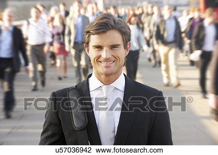 Stock Image - Male commuter in crowd. Fotosearch