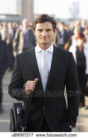 Stock Photo - Male commuter in crowd. Fotosearch