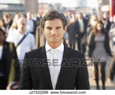 Male commuter in crowd View Large Photo Image Stock Photograph - Male commuter in crowd. Fotosearch
