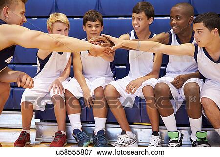 Stock Photo - Male High School Basketball Team Having Team Talk With Coach. Fotosearch