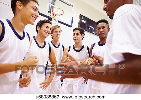 Male High School Basketball Team Having Team Talk With Coach View Large Photo Image Stock Photo - Male High School Basketball Team Having Team Talk With Coach. Fotosearch