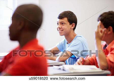 Stock Image - Male High School Pupil In Class. Fotosearch