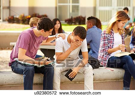 Male High School Student Comforting Unhappy Friend View Large Photo Image Stock Image - Male High School Student Comforting Unhappy Friend. Fotosearch