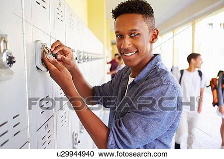 Male High School Student Opening Locker View Large Photo Image Stock Image - Male High School Student Opening Locker. Fotosearch