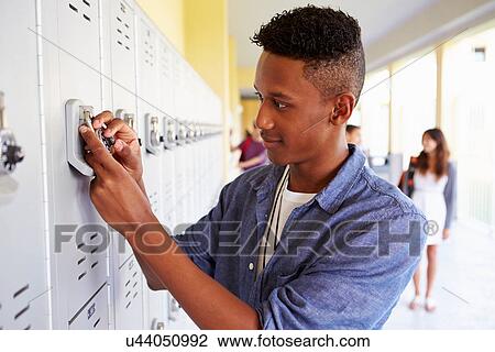 Male High School Student Opening Locker View Large Photo Image Stock Image - Male High School Student Opening Locker. Fotosearch
