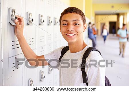 Male High School Student Opening Locker View Large Photo Image Stock Image - Male High School Student Opening Locker. Fotosearch