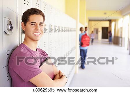 Male High School Student Standing By Lockers View Large Photo Image Stock Photography - Male High School Student Standing By Lockers. Fotosearch
