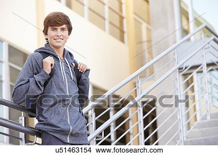 Picture - Male High School Student Standing Outside Building. Fotosearch